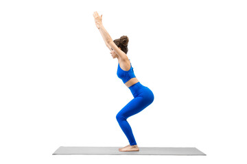 Caucasian young woman in blue sportswear practice chair pose, Utkatasana, isolated on white.
