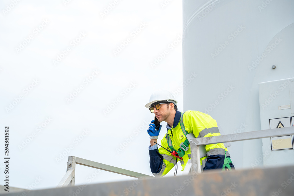 Aufkleber engineer working with wind turbines.