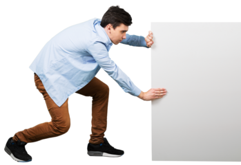 young man supporting a blank banner with both hands while crouching down