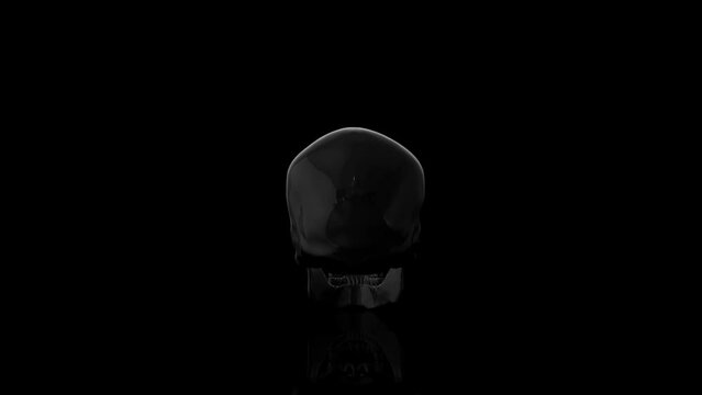 Black glass Skull turns on itself animation
