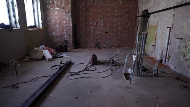 Home renovation gutted empty interior with bare walls and wires
