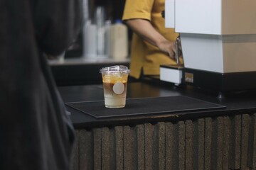 Close up a cup of coffee and bakery on wooden table background