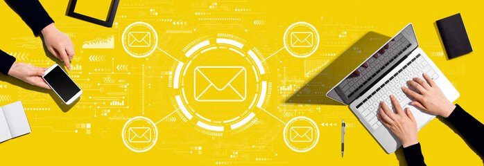 Email concept with two people working together