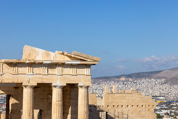 Propylaia, monumental ceremonial gateway to the Acropolis of Athens, Greece. Aerial view of the city in the distance