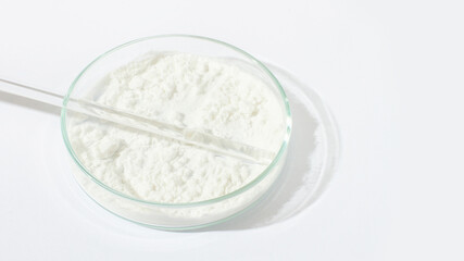 White powder in a Petri dish. Cocaine, cannabinoid, medicinal powder, antibiotic. lab, research.
