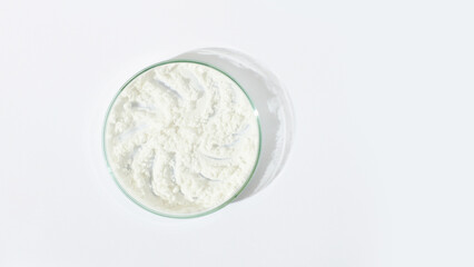 White powder in a Petri dish. Cocaine, cannabinoid, medicinal powder, antibiotic. lab, research.