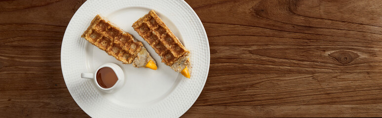 Oatmeal Belgian waffles in pencil shape on rustic wooden table. Flat lay top view