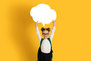 Cute Happy Little Schoolgirl Holding Blank Speech Bubble Above Head