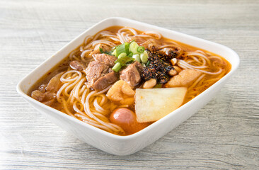 Rice Noodles with Chinese Beef on Plate served at table.