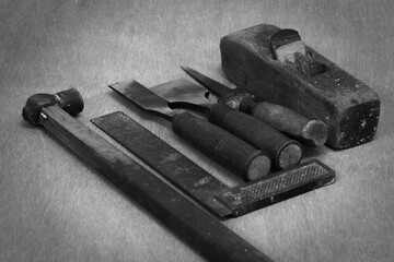 Different tools used in the carpentry work. Work bench with tools of a carpenter doing wood work.