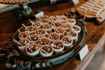 Closeup of a festive table with a pile of sweets during the ceremony