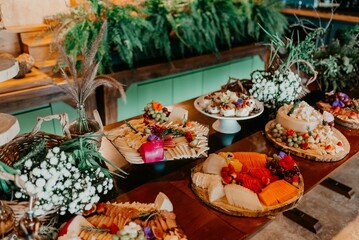 a long table with several platters of food on it