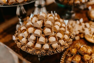 Closeup of a festive table with a pile of sweets during the ceremony