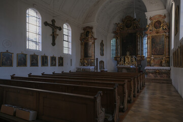 Magnificent opulent splendid Bavarian baroque church basilica interiors with stucco, murals, altar, Pilars, ceiling paintings, gold, wood domes nave	