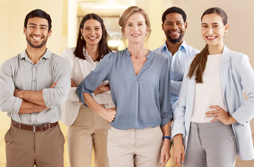 Be willing to work harder and give more than anyone else. Portrait of a diverse group of businesspeople standing together in an office.