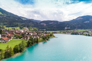 Fototapeta na wymiar View of lake Lungern with green fields in summer, Switzerland