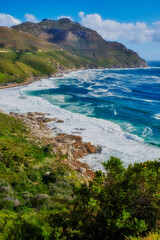 A photo of mountains, coast and ocean from Shapmanns Peak,. A photo mountains, coast and ocean from Shapmanns Peak, with Hout Bay in the background. Close to Cape Town.