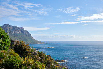 A photo of mountains, coast and ocean from Shapmanns Peak,. A photo mountains, coast and ocean from Shapmanns Peak, with Hout Bay in the background. Close to Cape Town.