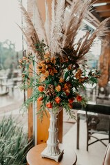 Closeup of floral decorations and bouquets on the table for a wedding celebration