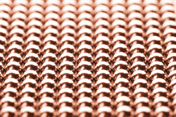 Small rose gold magnetic balls as background, closeup
