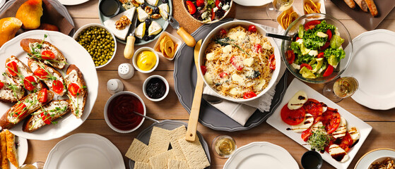 Different tasty food for brunch on wooden table, flat lay. Banner design