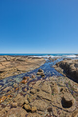 Rocky coastline of the Camps Bay, Western Cape. Ocean view - Camps Bay, Table Mountain National...