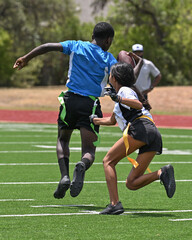 Young athletic children playing in a competitive flag football game