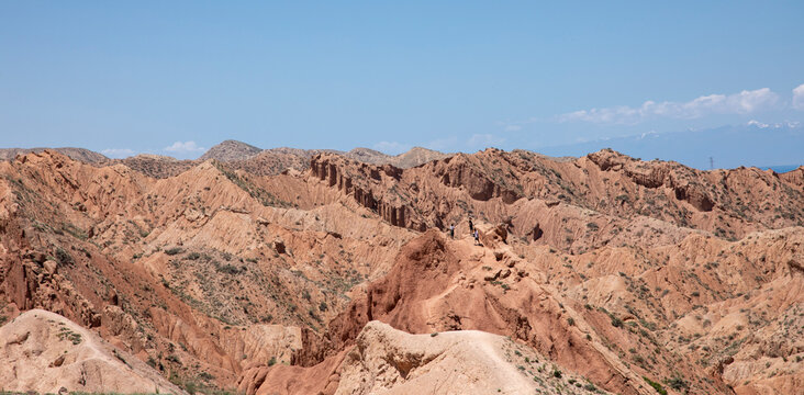 Panoramic photo of the arid desert of Skazka Canyon in Kyrgyzstan.