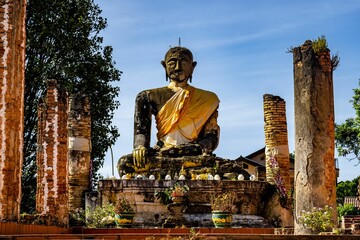 Ancient and worn statue of Buddha in Wat Phiawat, Xiangkhouang, Laos