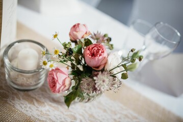 a glass vase is filled with some pink and white flowers