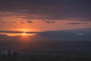 Scenic view of a country landscape at sunset with vibrant hues of orange and pink