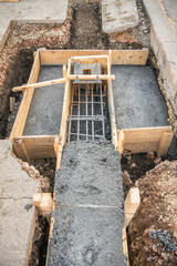 Construction pit with foundations lined with wooden boards