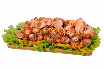 raw chicken meat on cutting board on white background