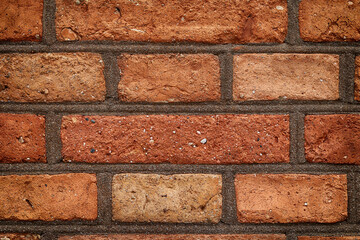 Fototapeta premium Mur z czerwonej cegły z równych prostokątów. Ściana. 