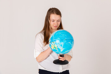 Smiling cute girl with special needs on white background. Child with disabilities. Equal opportunities for all. School Concept, Graduating Class. Education for disabled children concept