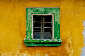 Obraz na płótnie Canvas House facade with green window.