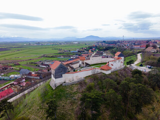 Fototapeta premium Aerial photography of the Feldioara medieval outpost, located in Brasov county, Romania. Photography was shot from a drone with camera level for a landscape view of the fortification.