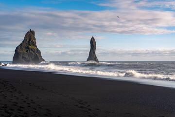 Reynisdrangar basalt sea stacks at Reynisfjara black sand beach. Near Vik, Iceland. Southern point...