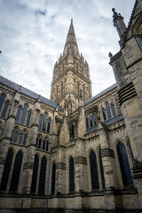 Fototapeta premium Salisbury Cathedral exterior with tallest church spire in United Kingdom. Early English Gothic structure with clerestory windows and North transept.