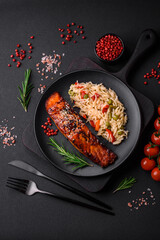 Delicious red salmon fish grilled with sauce and sesame seeds with rice and vegetables
