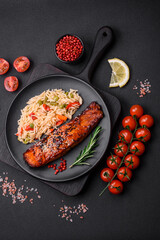 Delicious red salmon fish grilled with sauce and sesame seeds with rice and vegetables