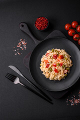 Delicious boiled rice with vegetables peppers, carrots, peas and asparagus beans