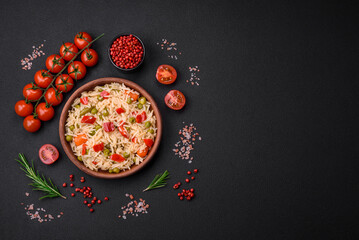 Delicious boiled rice with vegetables peppers, carrots, peas and asparagus beans