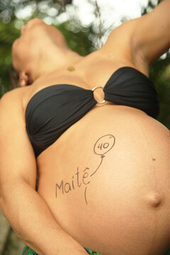 image of a pregnant woman with the baby's name written