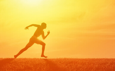 Fototapeta na wymiar Male runner silhouette doing sprints. Active sport workout concept. 
