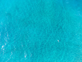 Aerial view of surfer surrounded by water