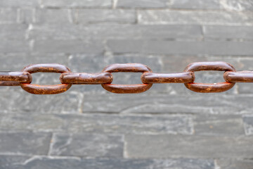 Old rusty metal links padlock, symbol of binding and togetherness.