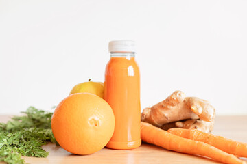 Healthy fresh orange, carrot and ginger smoothie with assorted ingredients. Superfood detox and diet concept. Top view, flat lay