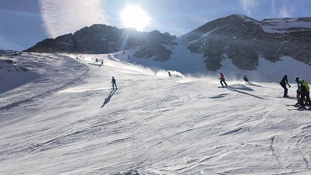 Skiing season footage on top of Marmolada glacier, the highest point in the Dolomites mountains in Italy	
