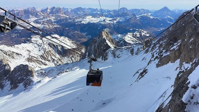 Skiing season footage on top of Marmolada glacier, the highest point in the Dolomites mountains in Italy	